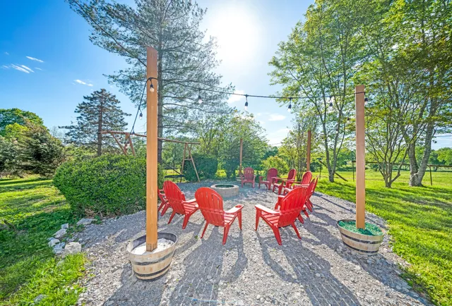 a living room with furniture a wooden floor and a rug