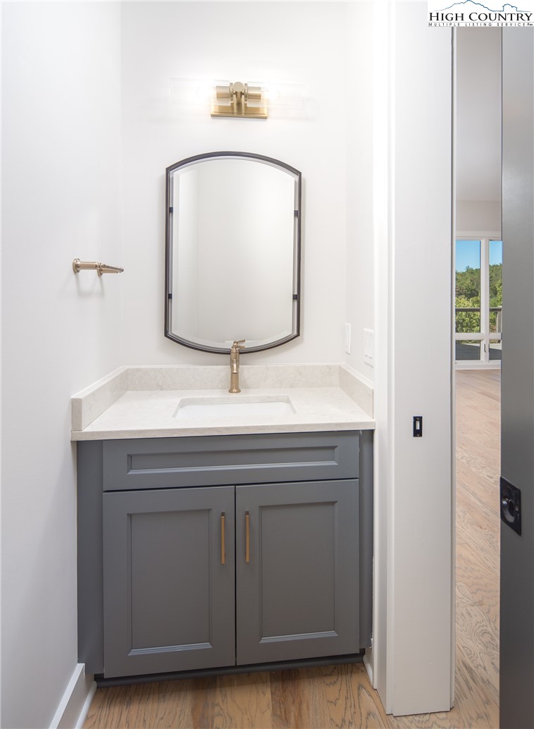 353 Calico Court Boone, NC 28607 - Photo 12 of 50 a bathroom with a sink and a mirror
