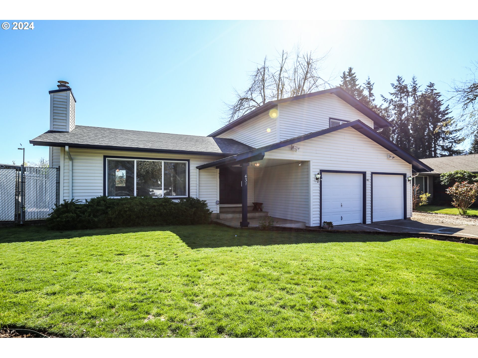 431 65th Street Springfield, OR 97478 - Photo 1 of 32 a view of a house with a yard and lawn chairs with plants
