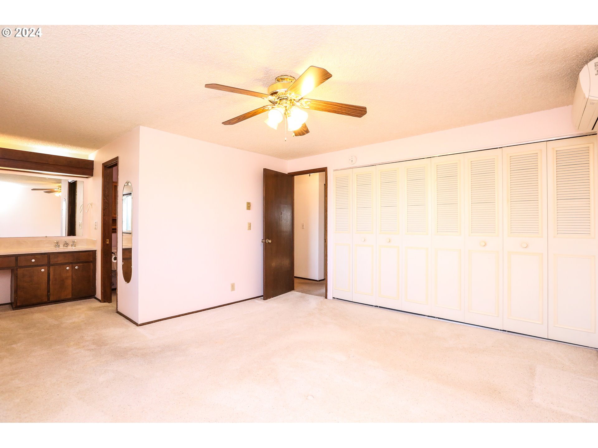 431 65th Street Springfield, OR 97478 - Photo 25 of 32 a view of a room with a white cabinet and a refrigerator