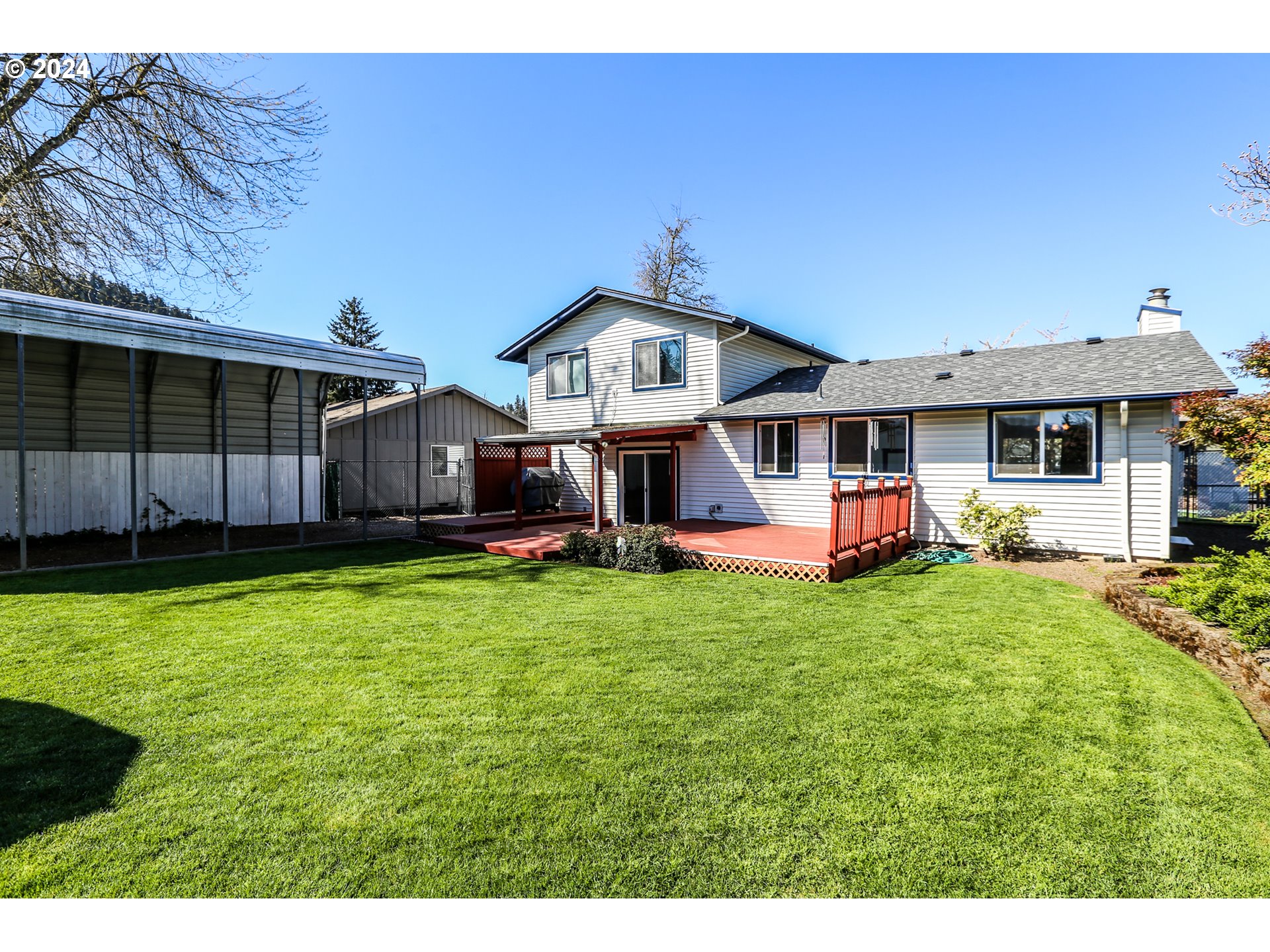 431 65th Street Springfield, OR 97478 - Photo 5 of 32 a view of a house with a yard and sitting area