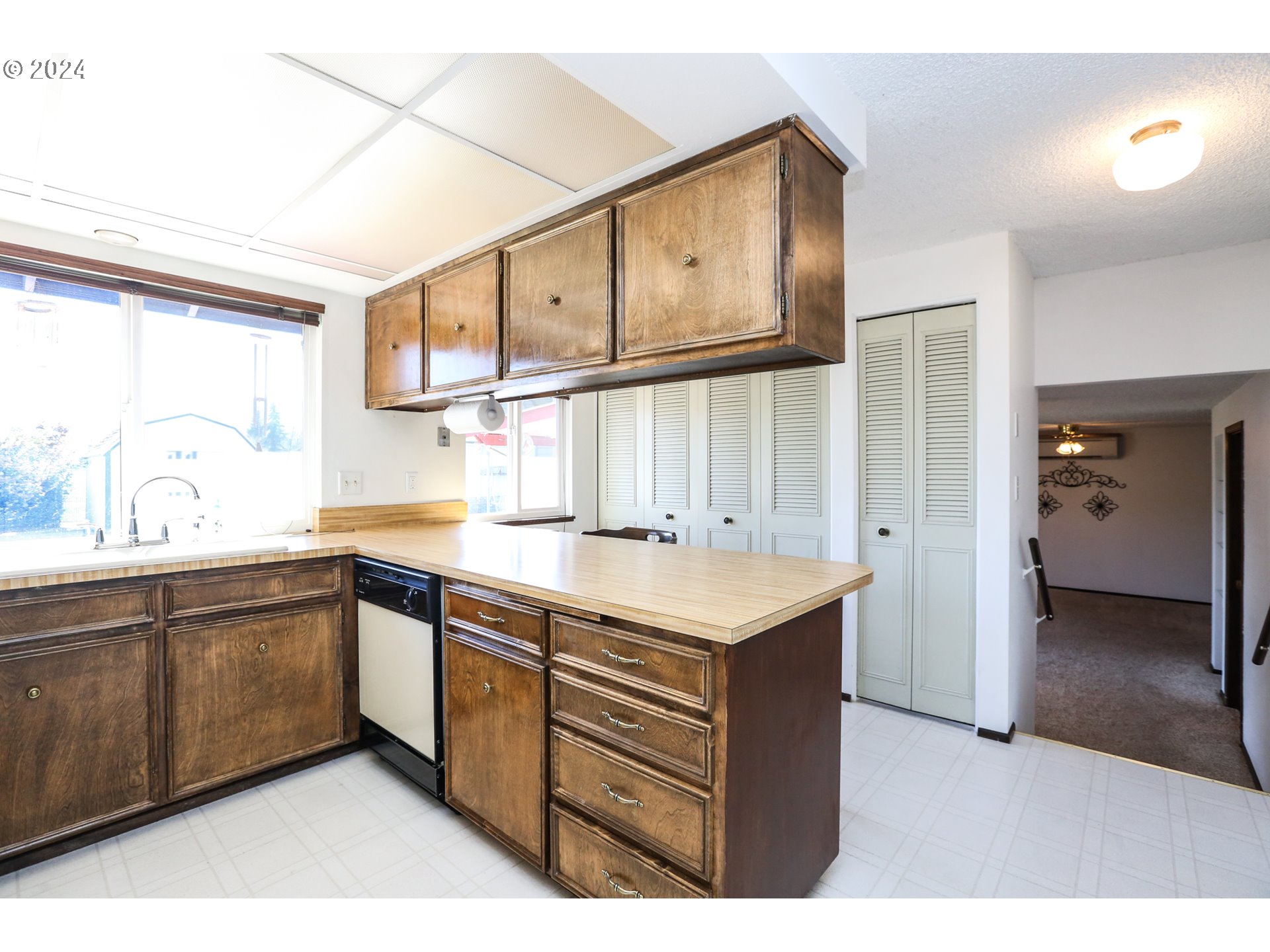 431 65th Street Springfield, OR 97478 - Photo 9 of 32 a kitchen with stainless steel appliances granite countertop a sink and wooden cabinets