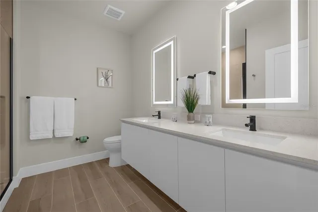 a bathroom with a glass shower door