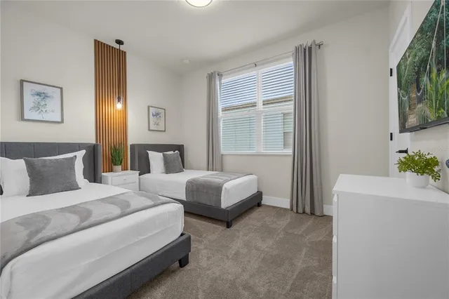 a bedroom with double bed and a window