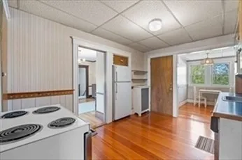 a bedroom with a bed and a table with chair