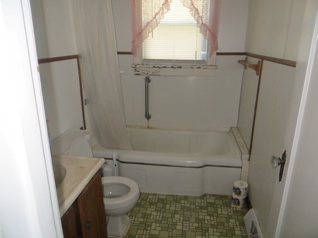 30702 North 1700th Road East Odell, IL 61313 - Photo 26 of 32 a bathroom with a granite countertop toilet and a shower