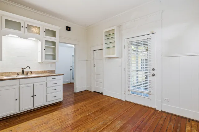 a spacious bathroom with double vanity and a mirror