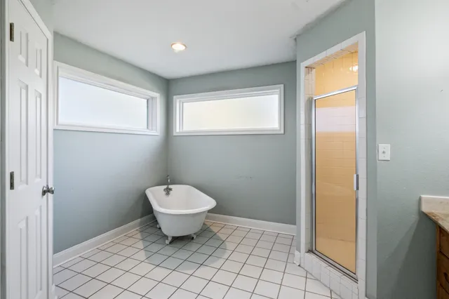 a bathroom with a toilet sink and window