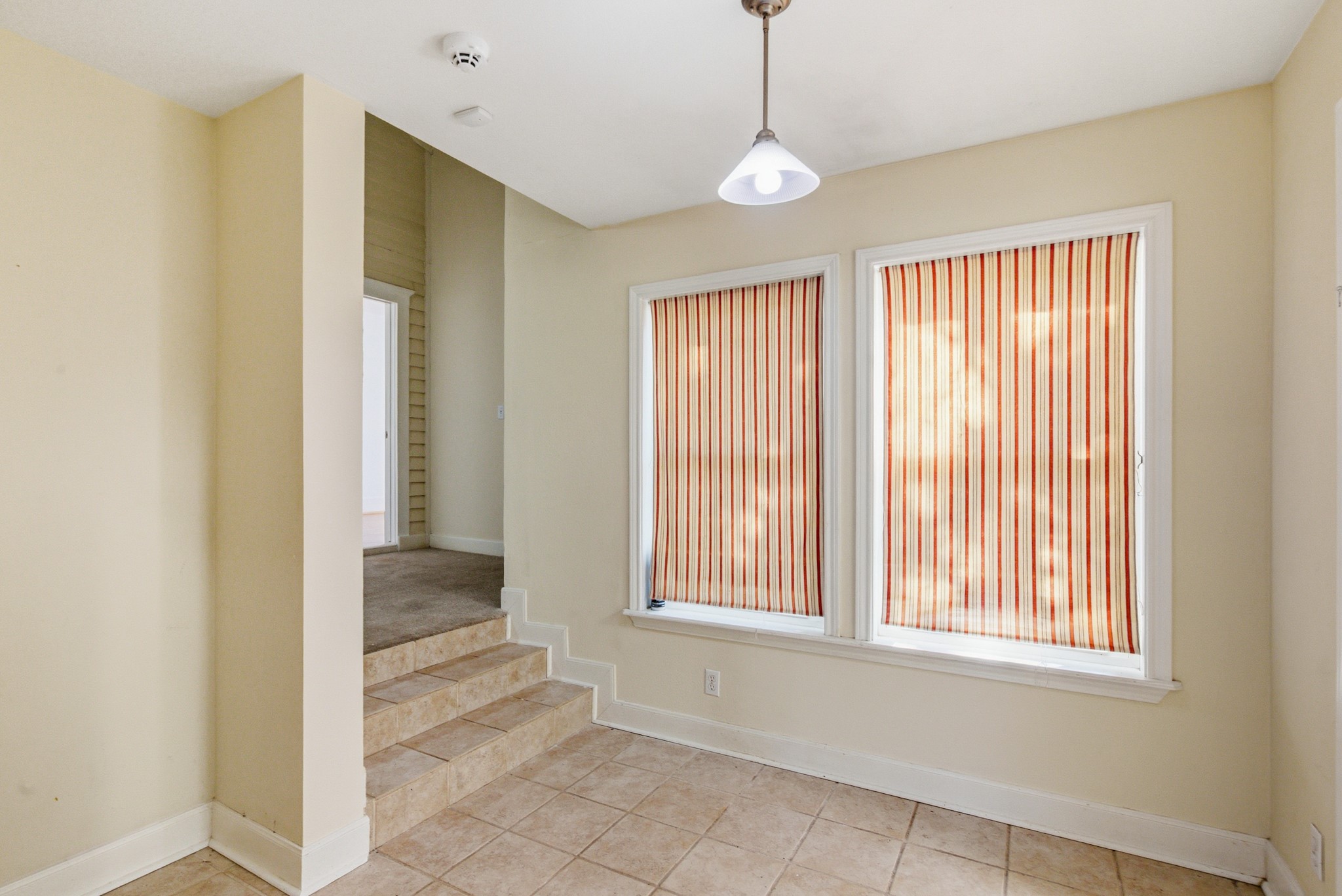 901 North Craig Street Victoria, TX 77901 - Photo 38 of 46 a view of an empty room with window and chandelier fan