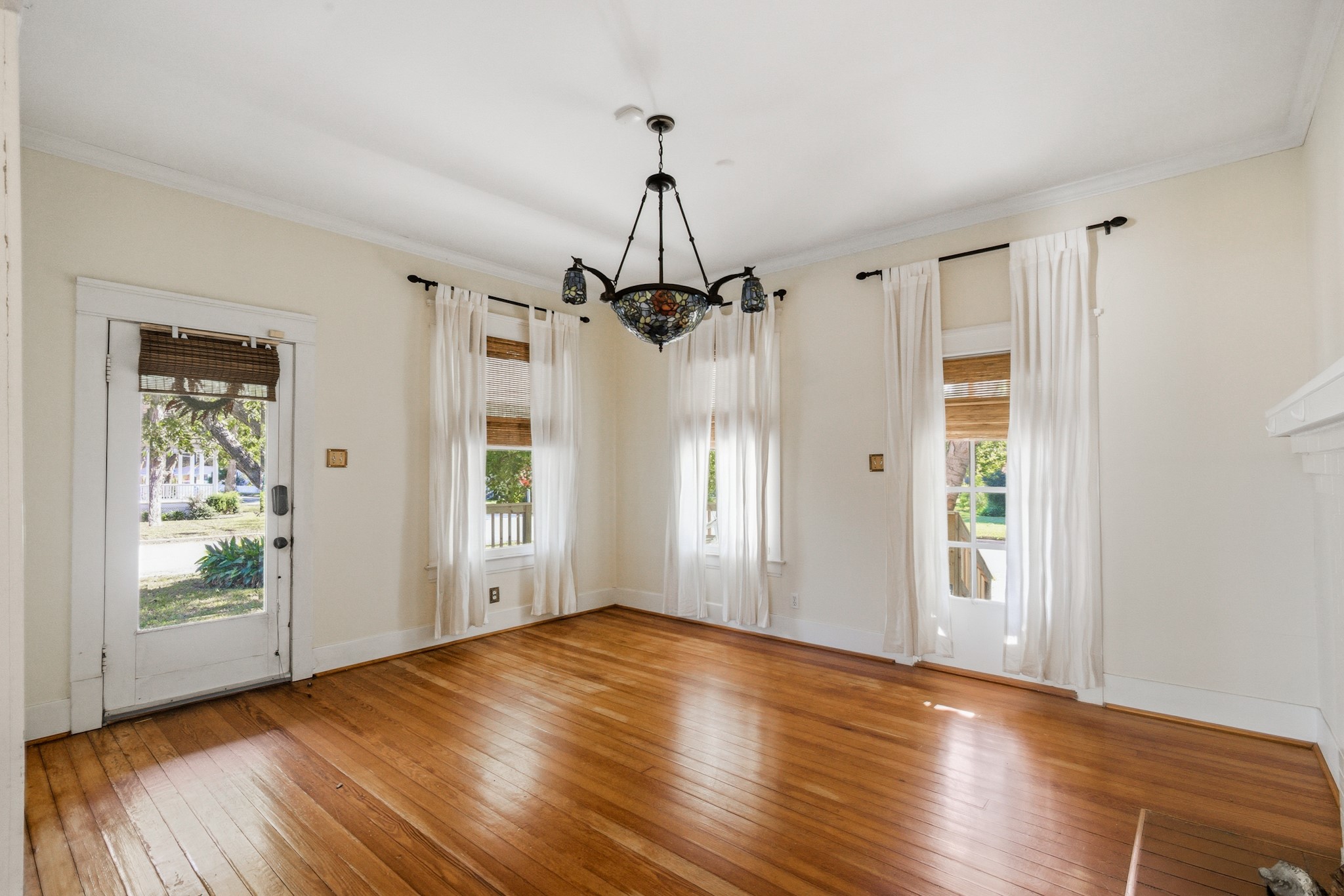 901 North Craig Street Victoria, TX 77901 - Photo 5 of 46 wooden floor in an empty room with a window