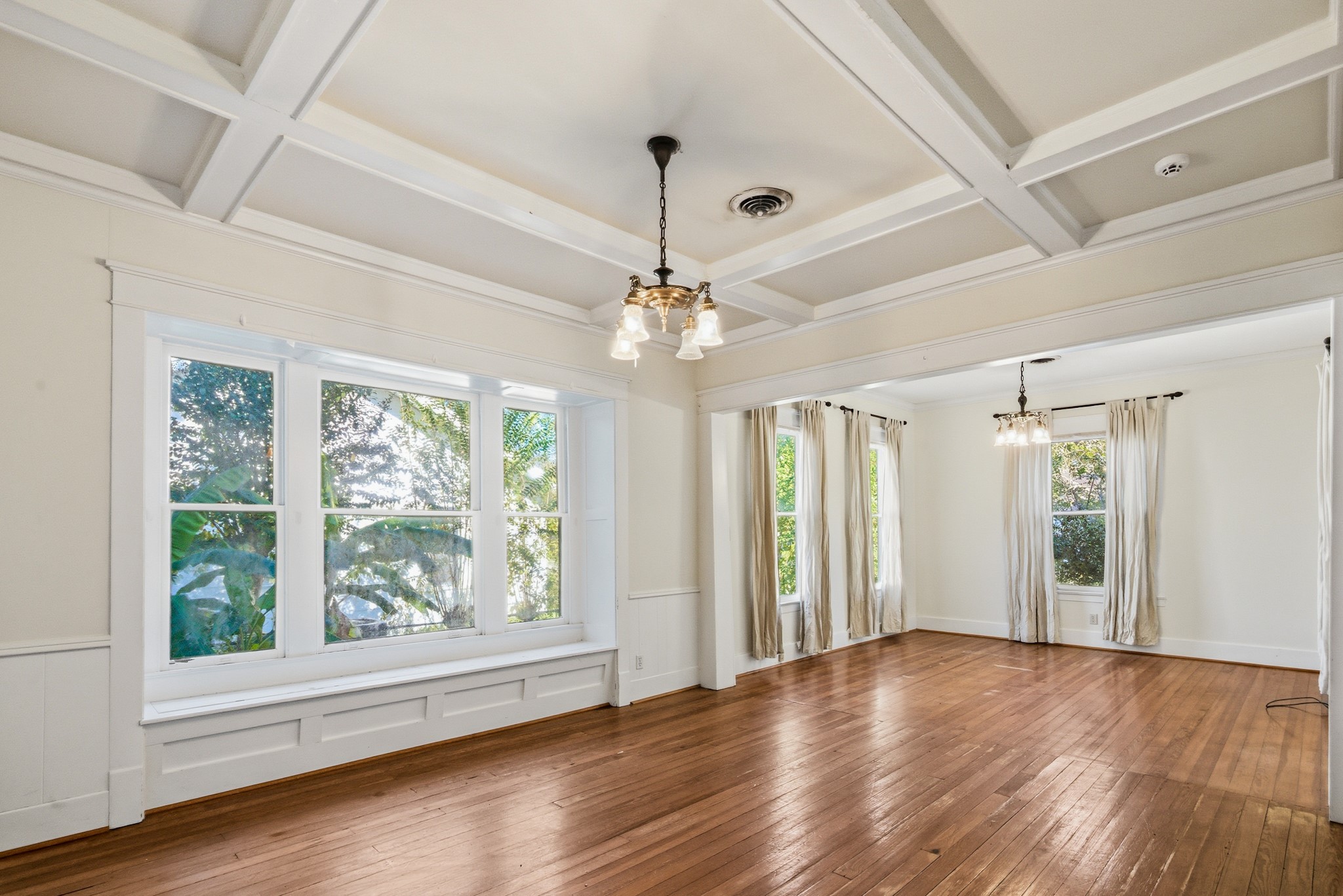 901 North Craig Street Victoria, TX 77901 - Photo 9 of 46 a view of an empty room with wooden floor and a window