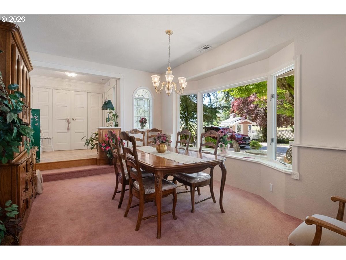 1300 Fair Oaks Road Oakland, OR 97462 - Photo 6 of 48 a dining room with furniture a chandelier and window