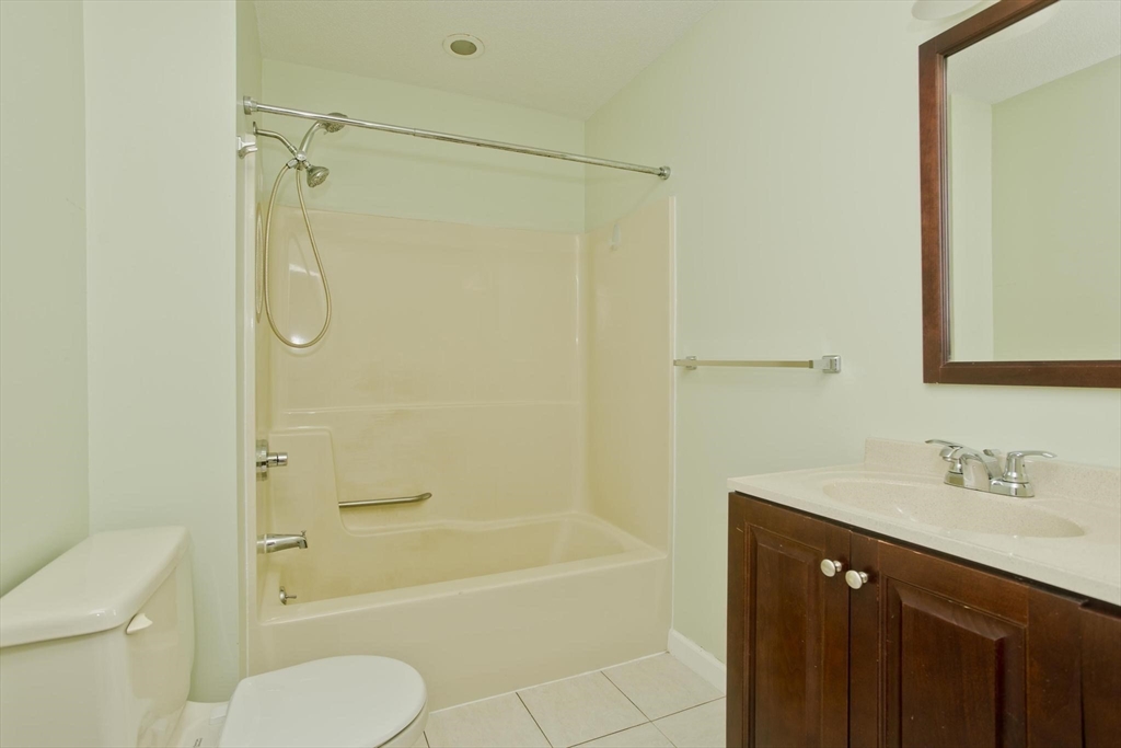 610 County Road, Unit 7 Holyoke, MA 01040 - Photo 12 of 24 a bathroom with a granite countertop bathtub shower sink vanity and toilet