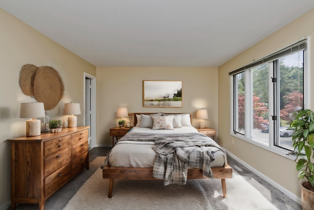 610 County Road, Unit 7 Holyoke, MA 01040 - Photo 16 of 24 a bedroom with a large bed and a window