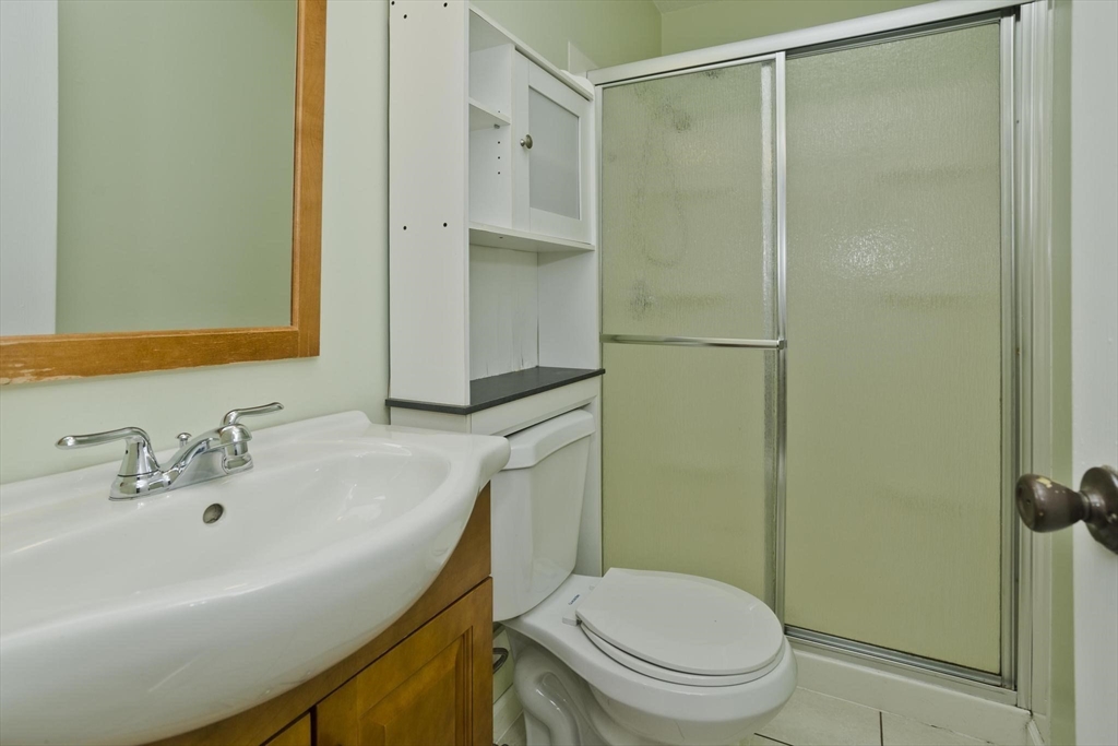 610 County Road, Unit 7 Holyoke, MA 01040 - Photo 17 of 24 a bathroom with a sink a toilet and shower