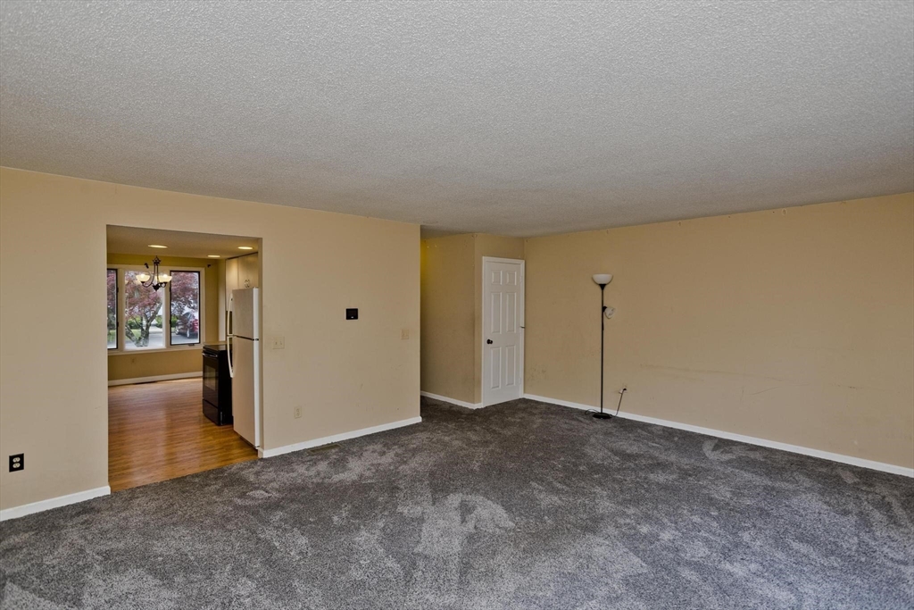 610 County Road, Unit 7 Holyoke, MA 01040 - Photo 3 of 24 a view of an empty room and window