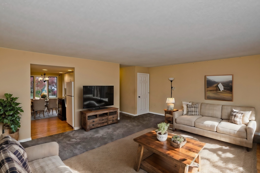 610 County Road, Unit 7 Holyoke, MA 01040 - Photo 4 of 24 a living room with furniture and a flat screen tv