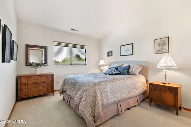 a bedroom with two bed and a closet