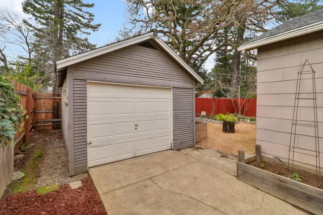 a view of a house with a yard and garage