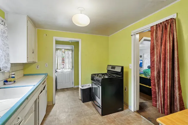 a bedroom with bed and window