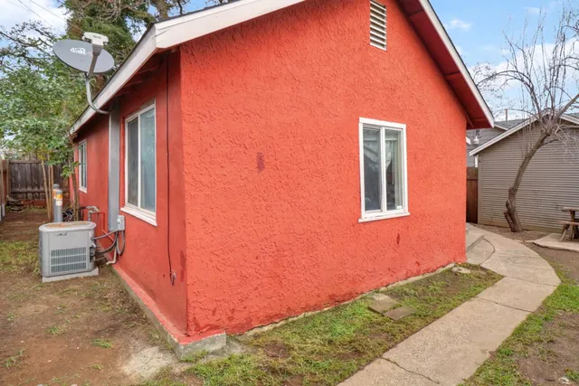a view of a backyard with wooden fence