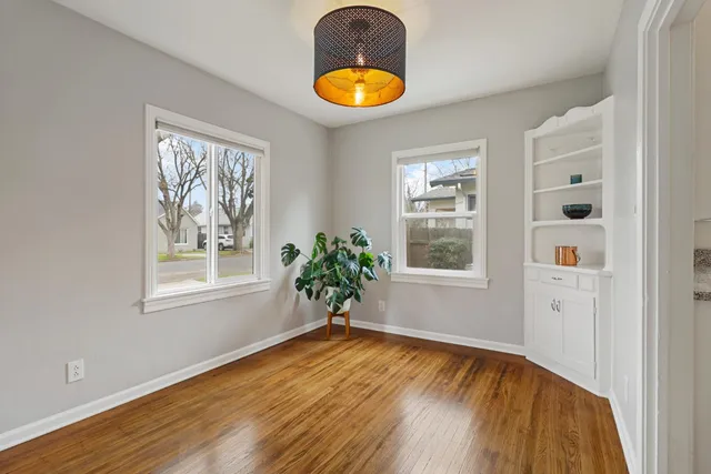 wooden floor in an empty room and a window