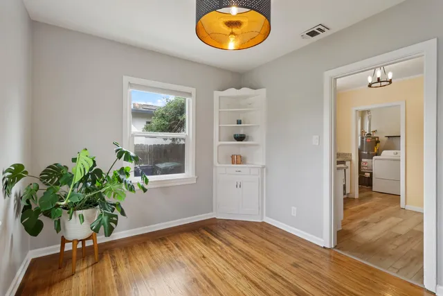 a kitchen with a sink cabinets and window