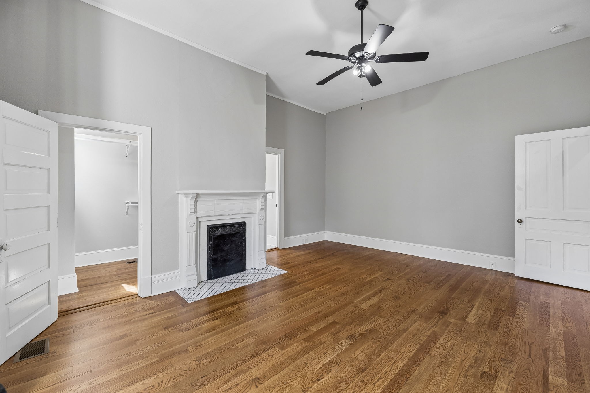 504 5th Avenue West Springfield, TN 37172 - Photo 19 of 57 a view of a livingroom with a fireplace a ceiling fan and wooden floor