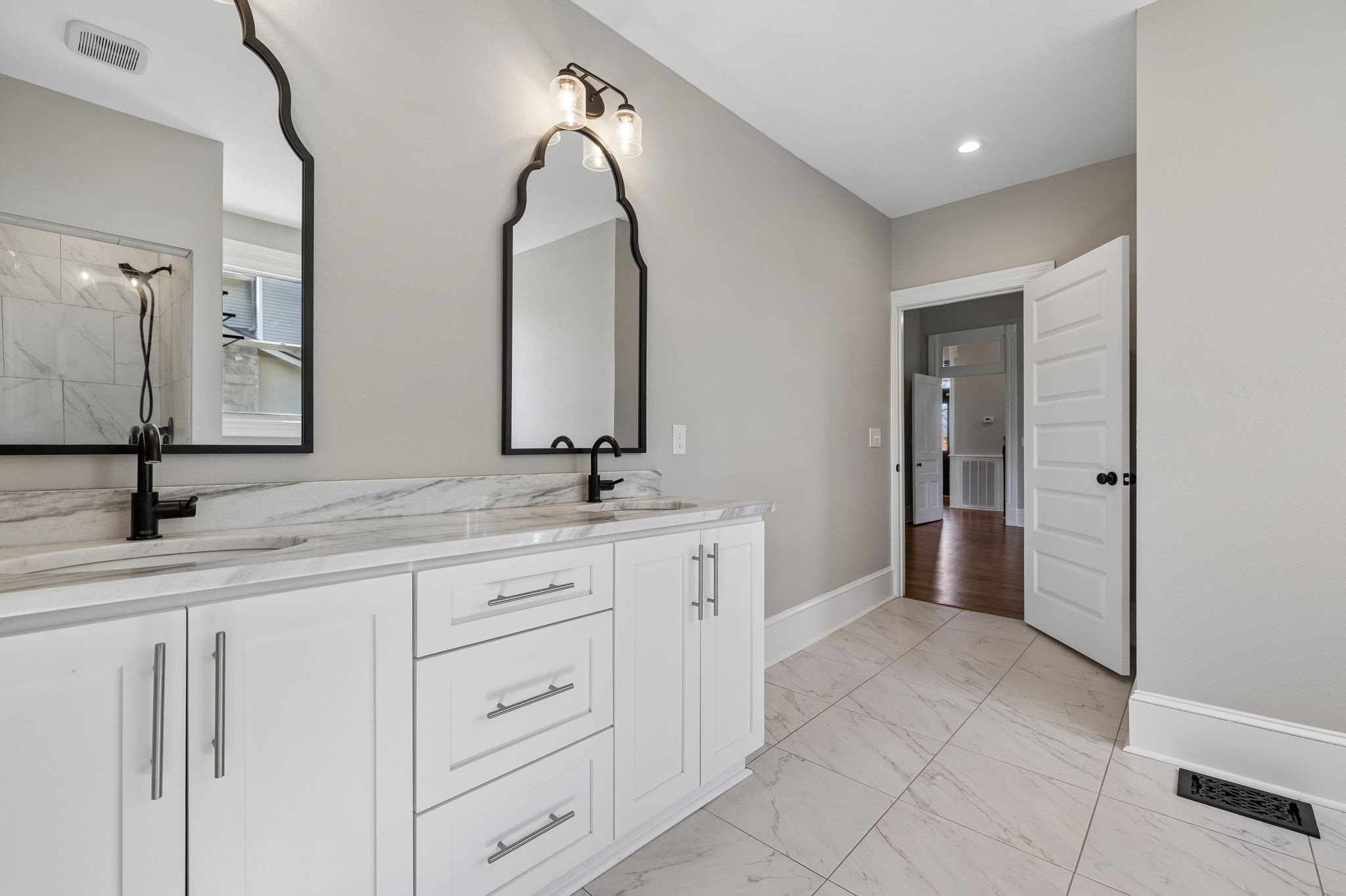 504 5th Avenue West Springfield, TN 37172 - Photo 20 of 57 a spacious bathroom with a double vanity sink and a mirror