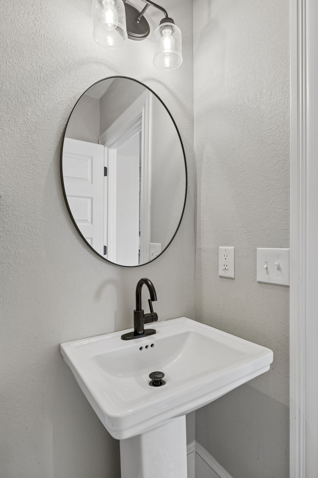 504 5th Avenue West Springfield, TN 37172 - Photo 26 of 57 a bathroom with a sink and mirror