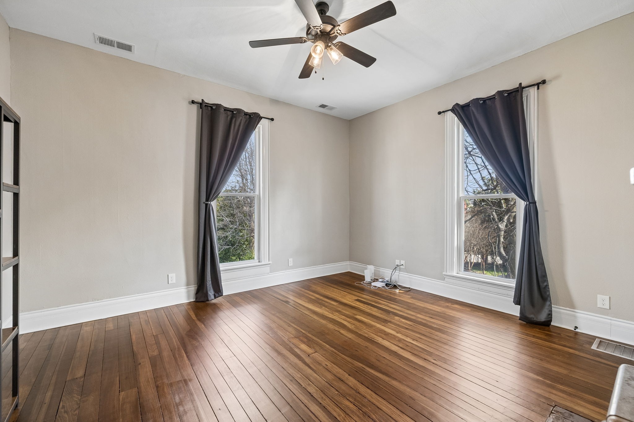 504 5th Avenue West Springfield, TN 37172 - Photo 33 of 57 a view of an empty room with wooden floor and a window