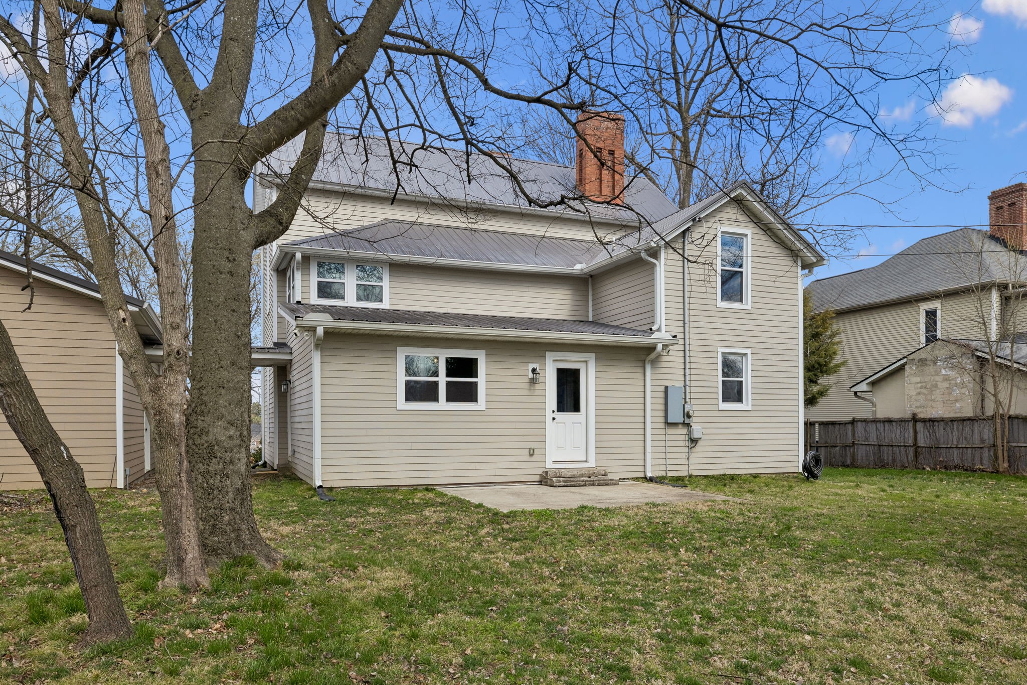 504 5th Avenue West Springfield, TN 37172 - Photo 46 of 57 a backyard of a house with wooden fence and large tree