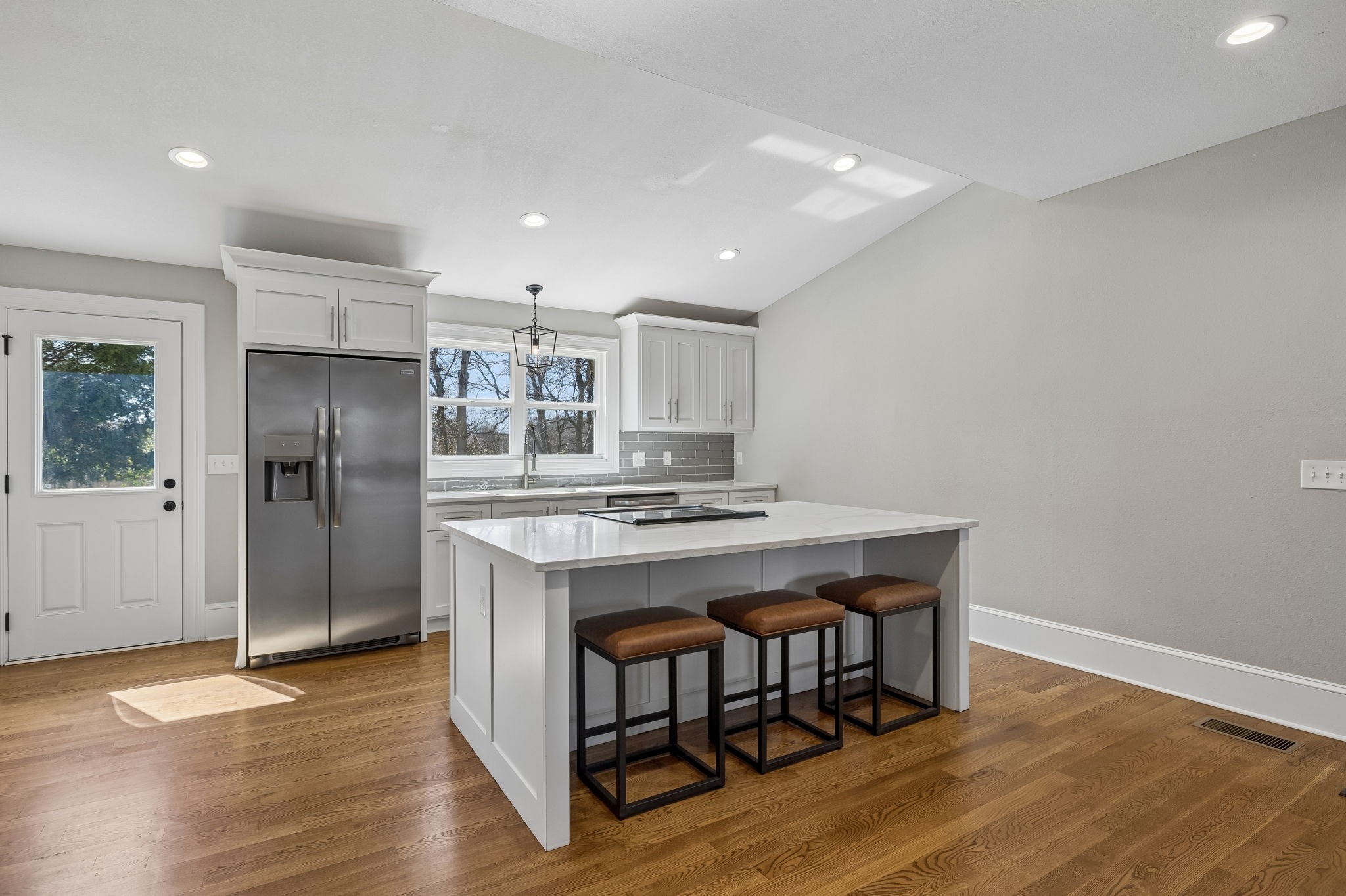 504 5th Avenue West Springfield, TN 37172 - Photo 10 of 57 a kitchen with kitchen island a wooden floor and refrigerator