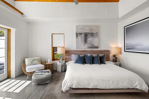 a bedroom with a bed and a couch