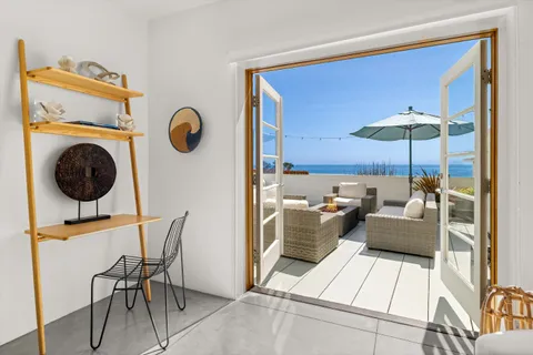 a living room with furniture and a view of living room