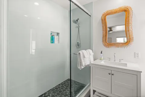 a bathroom with a sink and a mirror