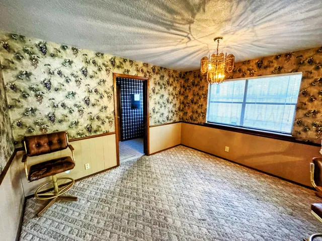 a view of bathroom with window and wooden floor