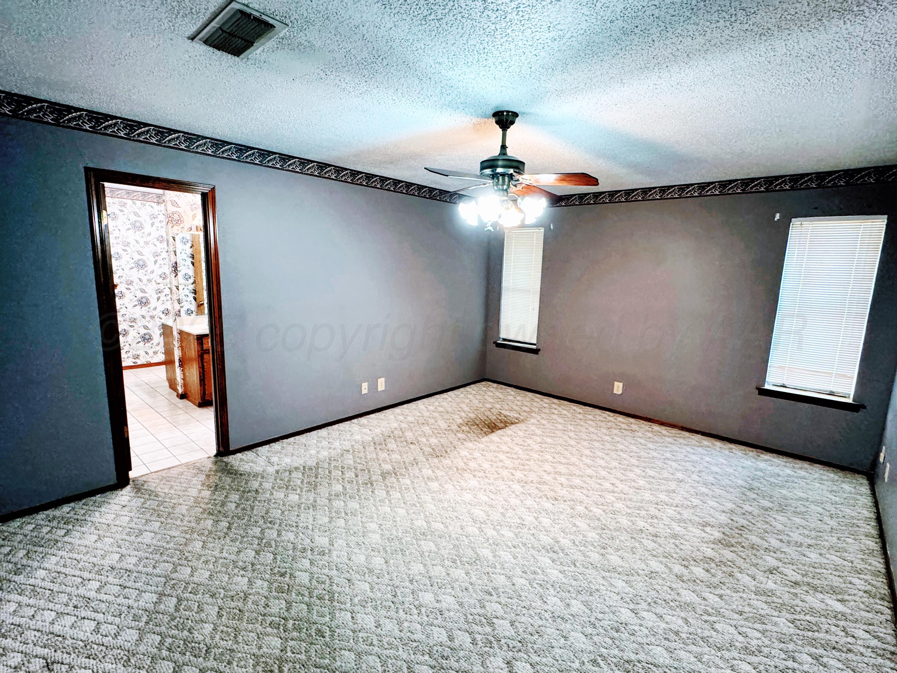 1905 Utah Street Perryton, TX 79070 - Photo 13 of 22 a view of an empty room and window