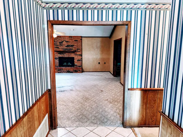 a view of a livingroom with furniture and staircase