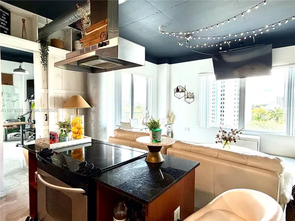 a kitchen with a table chairs stove and cabinets