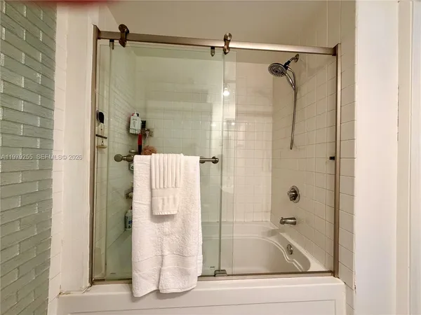 a bathroom with a shower and a bathtub