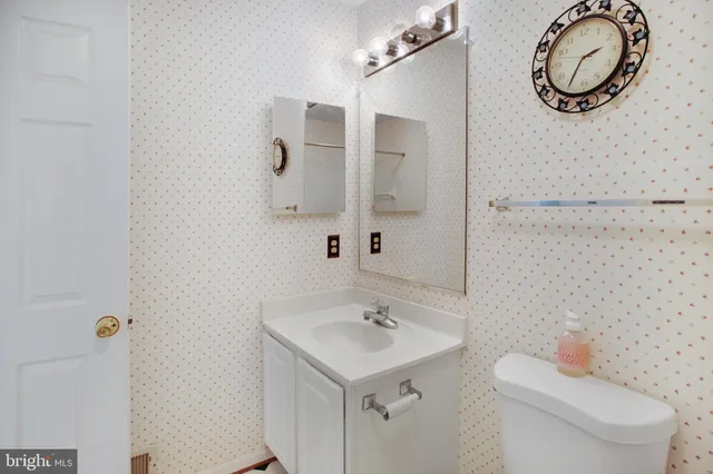 a view of a chair and tables in the balcony
