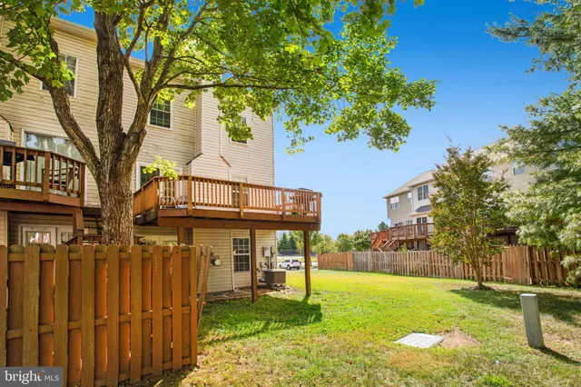 a view of a chair and tables in the balcony