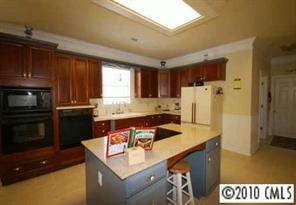 710 Beechnut Court Fort Mill, SC 29708 - Photo 4 of 8 a kitchen with a sink a refrigerator and a stove top oven