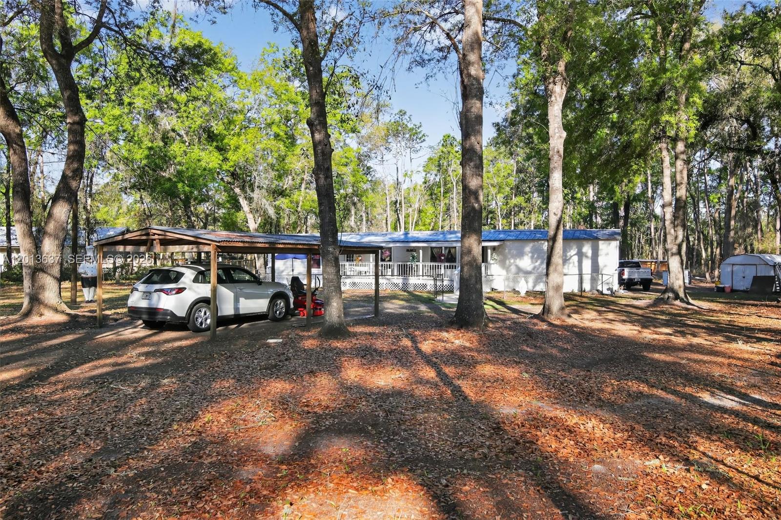 2522 Northwest 121st Avenue Gainesville, FL 32609 - Photo 11 of 40 a view of street with parked cars