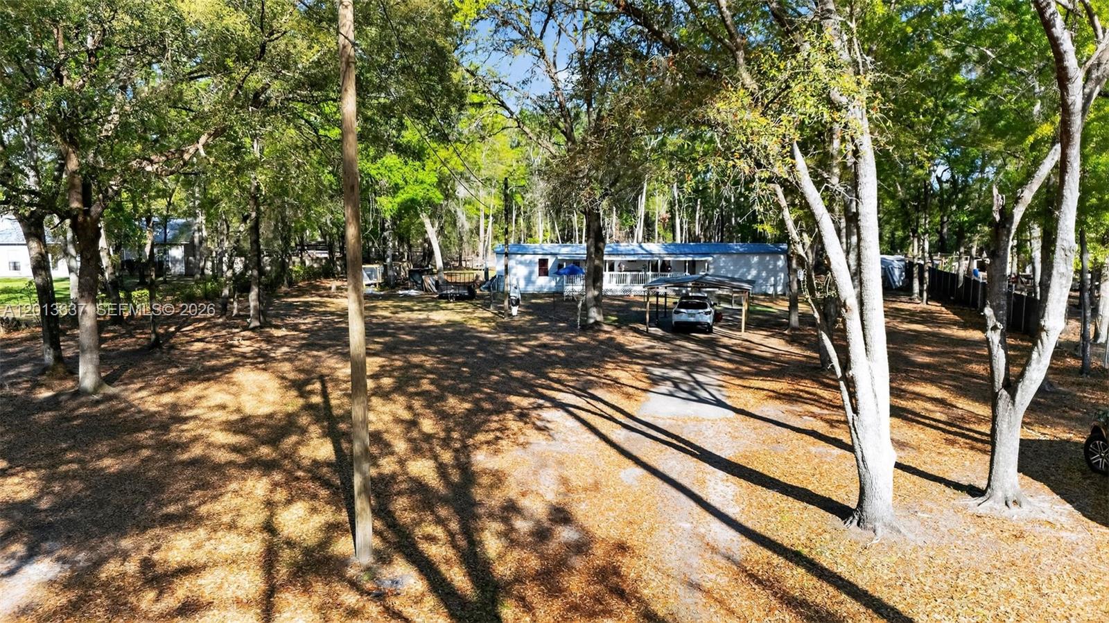 2522 Northwest 121st Avenue Gainesville, FL 32609 - Photo 13 of 40 a view of a yard with wooden fence