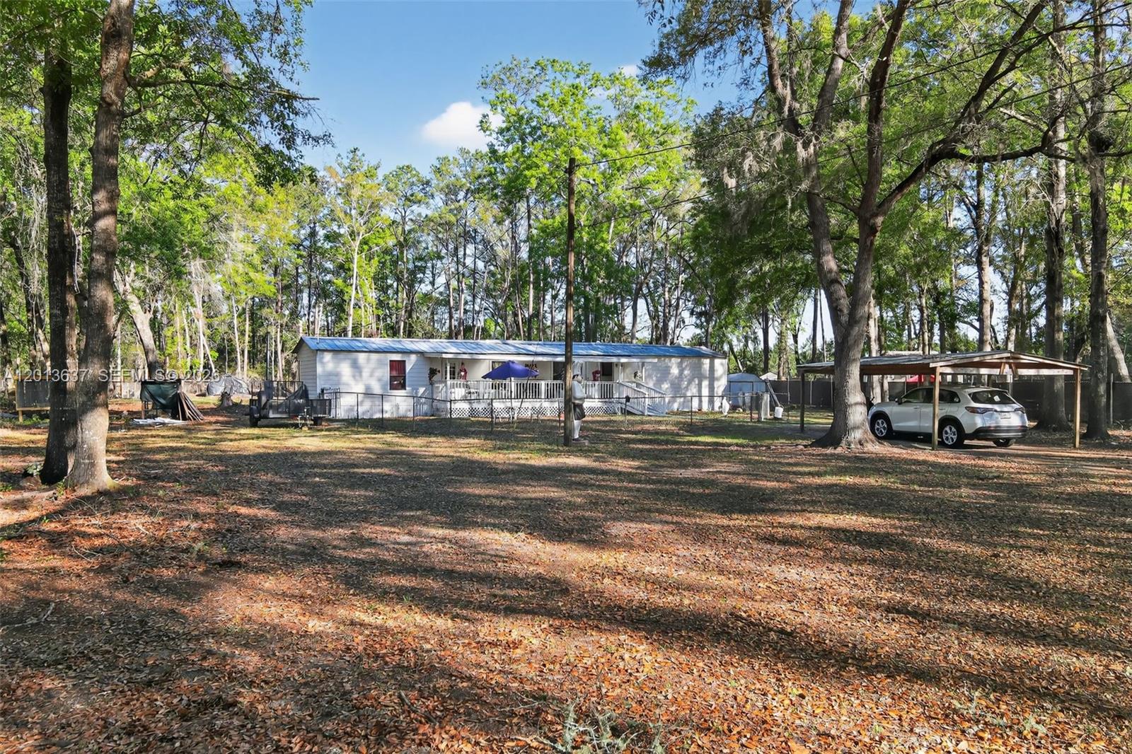 2522 Northwest 121st Avenue Gainesville, FL 32609 - Photo 14 of 40 a view of a yard with large trees