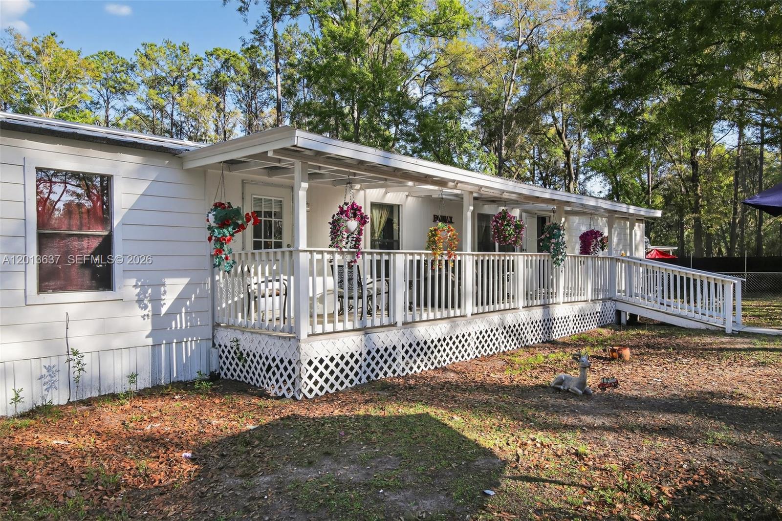 2522 Northwest 121st Avenue Gainesville, FL 32609 - Photo 16 of 40 a front view of a house with a porch