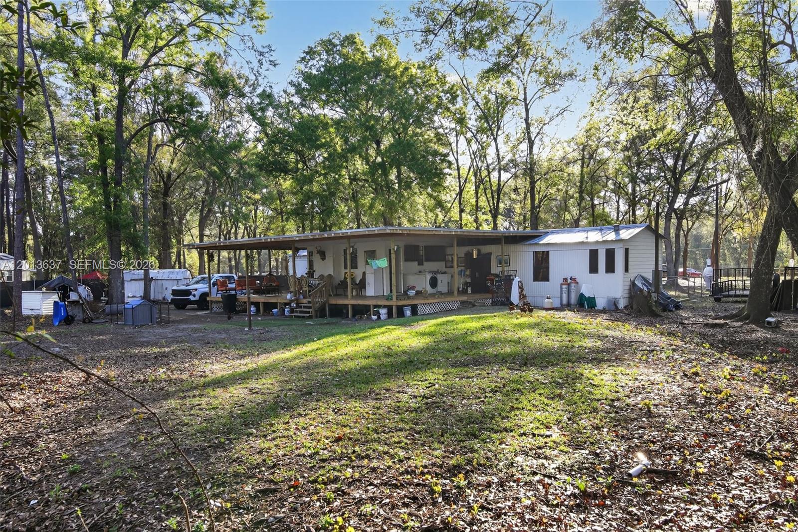 2522 Northwest 121st Avenue Gainesville, FL 32609 - Photo 17 of 40 a view of a house with backyard and sitting area