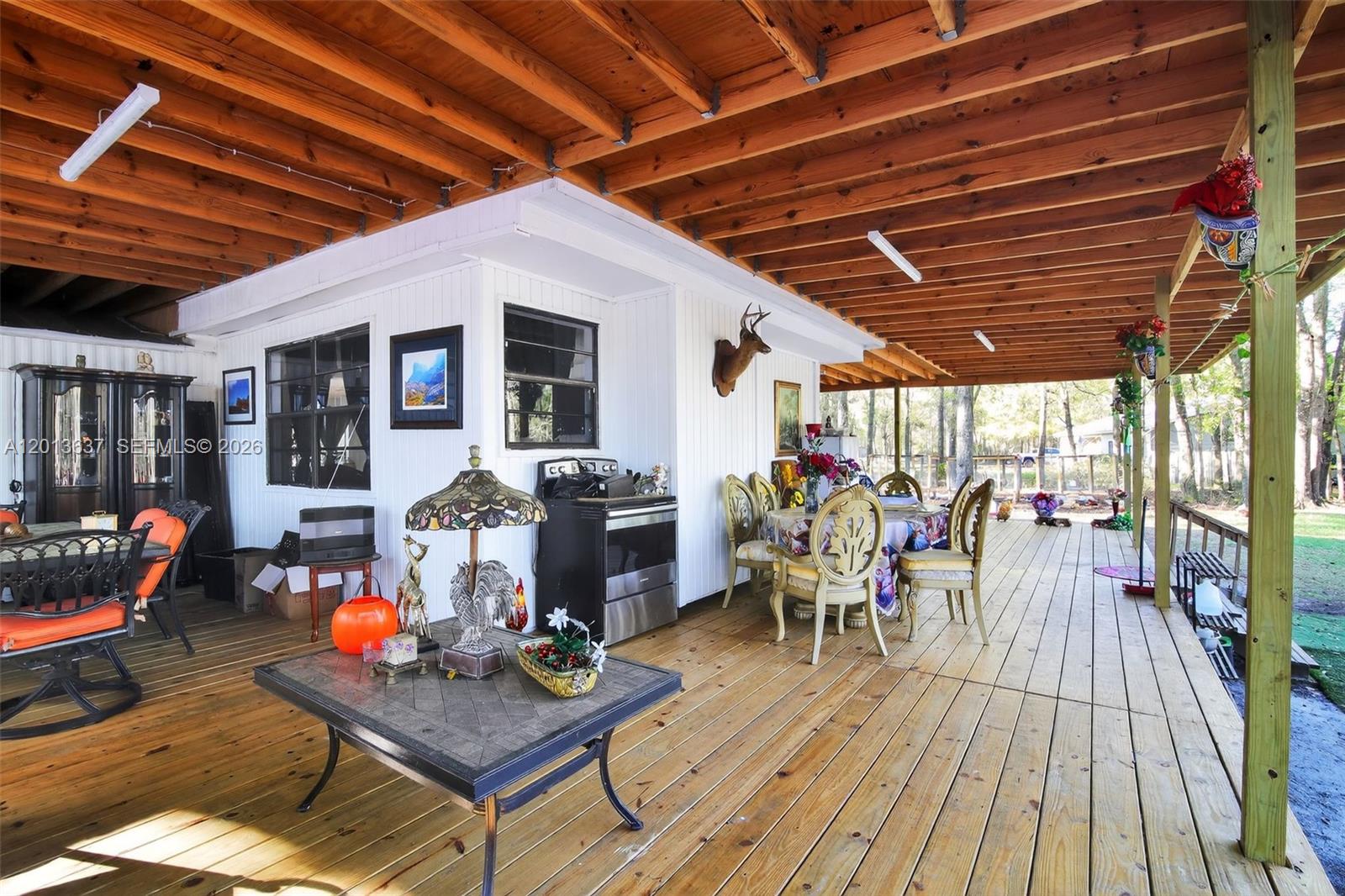 2522 Northwest 121st Avenue Gainesville, FL 32609 - Photo 20 of 40 a outdoor space with patio lots of furniture